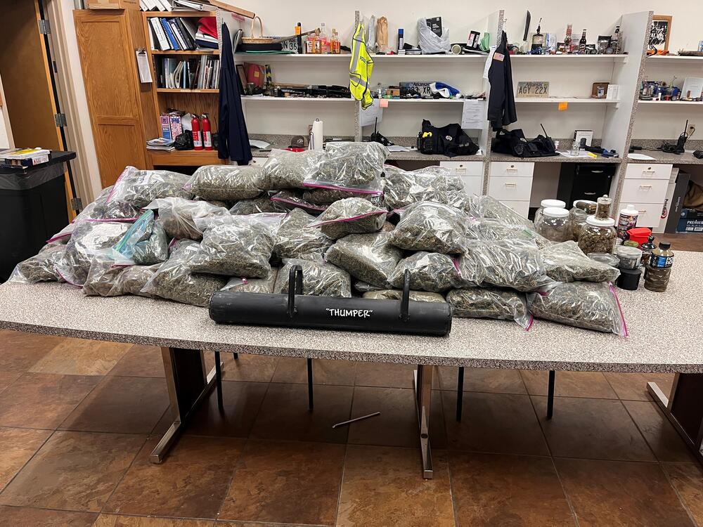 Photo of 90 pounds of alleged Marijuana on table