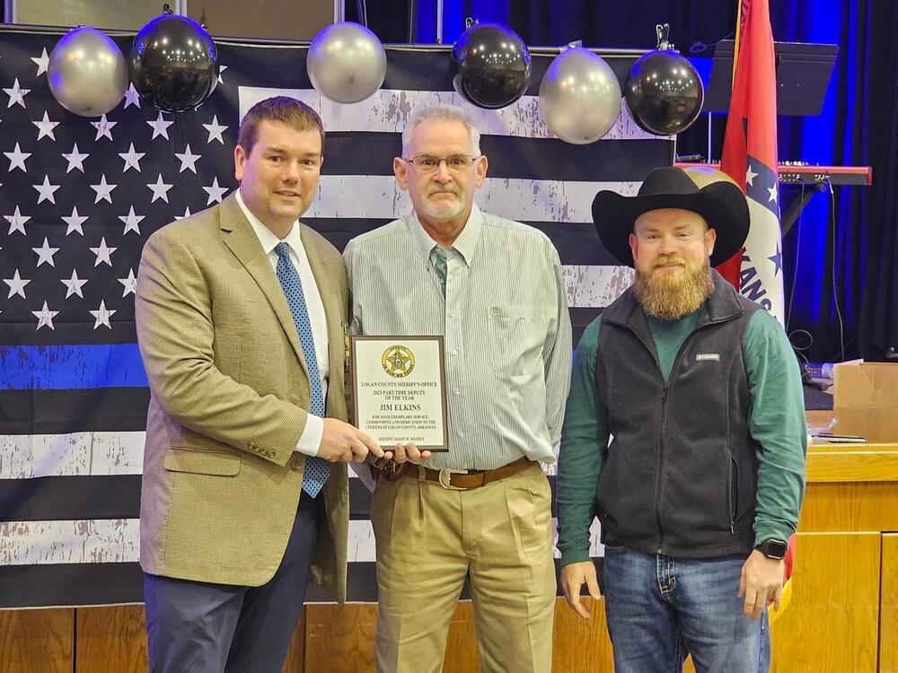 Photo of Jim Elkins receiving Award