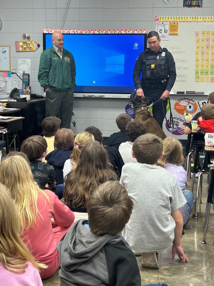 Investigator Bates and Corporal Matt Price with K-9