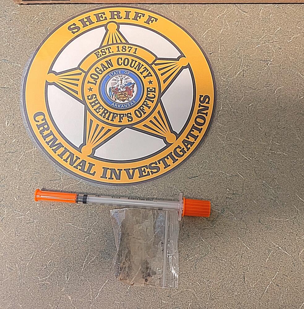 Photo of Suspected Heroin and a Syringe